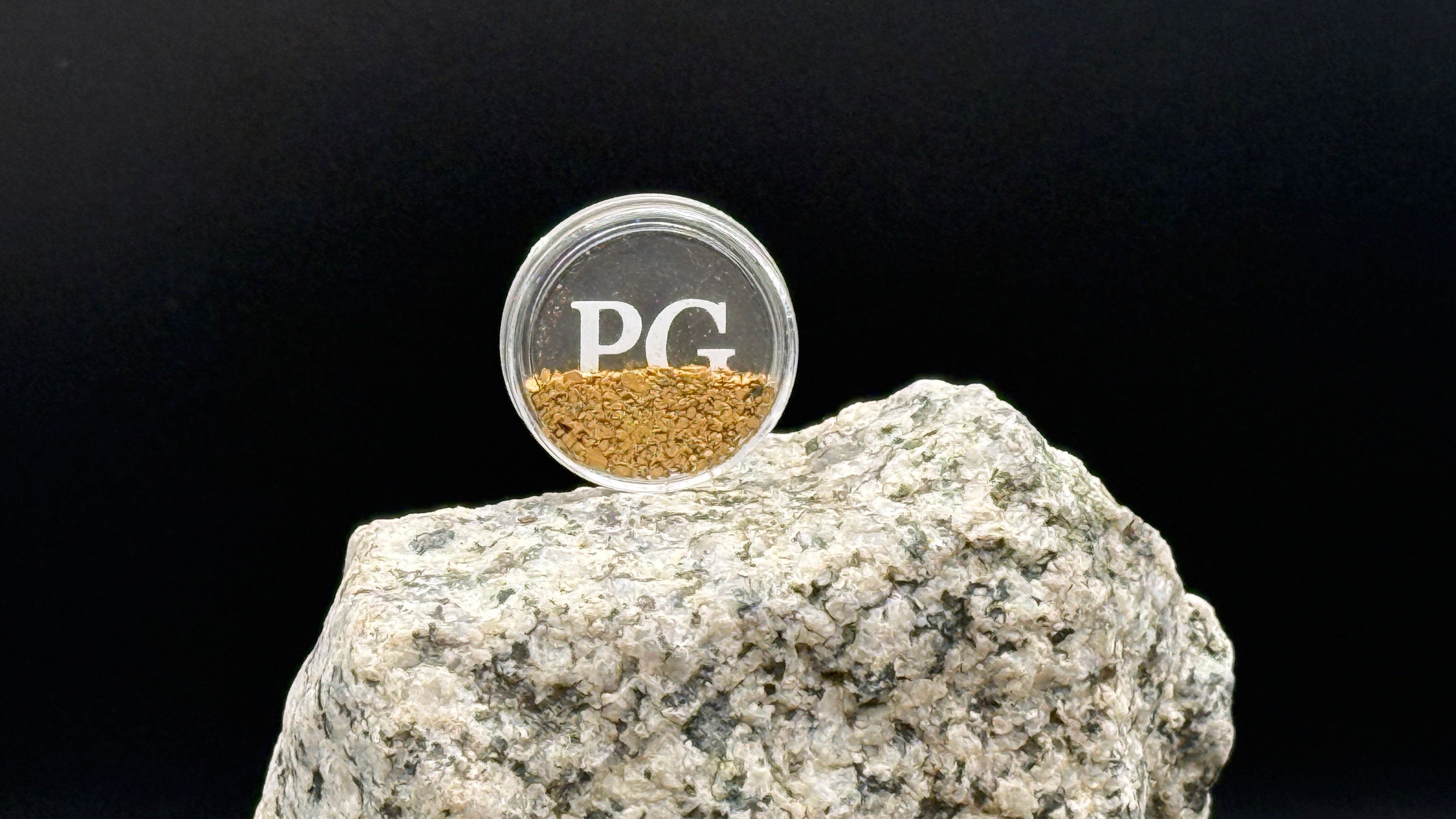 Coin shaped container with Yukon gold flakes Dominion Creek Parker Schnabel gold